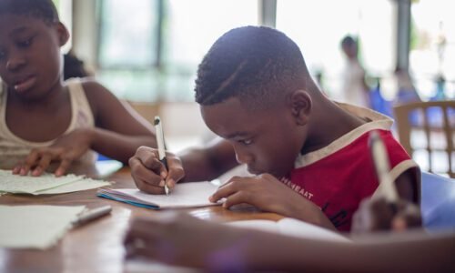 Boy writing on paper