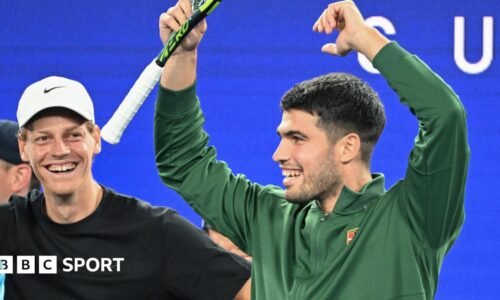 Jannik Sinner and Carlos Alcaraz watch on at the Australian Open