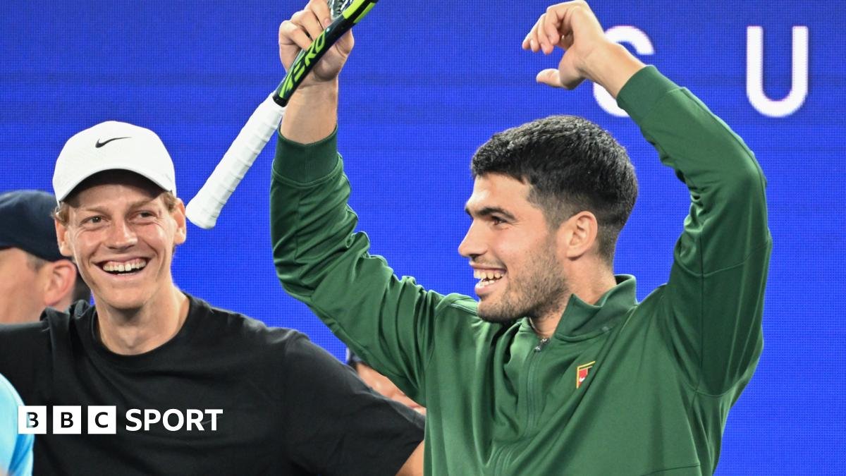 Jannik Sinner and Carlos Alcaraz watch on at the Australian Open