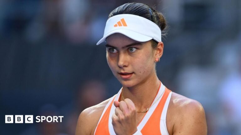 Iva Jovic clenches her fist in celebration at the Australian Open