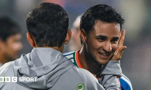 India head coach Gautam Gambhir (left) embraces batter Abhishek Sharma (right) after victory over New Zealand