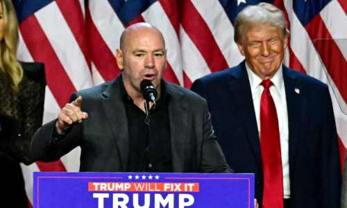 Dana White speaks at President Donald Trump's election night party in front of American flags and a 'Trump Will Fix It' sign