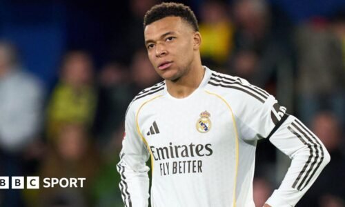 Real Madrid striker Kylian Mbappe with his hands on his hips during a La Liga game
