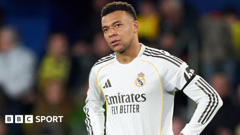 Real Madrid striker Kylian Mbappe with his hands on his hips during a La Liga game