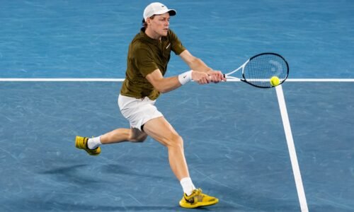 Jannik Sinner hits a backhand against Novak Djokovic at the 2026 Australian Open.