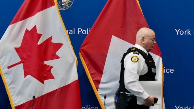 6 Toronto police officers charged in corruption probe now suspended without pay