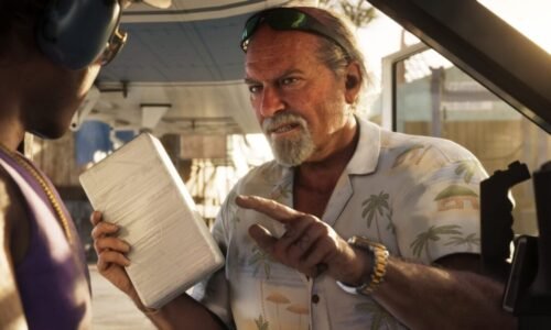 A man points his finger menacingly while holding a paper.