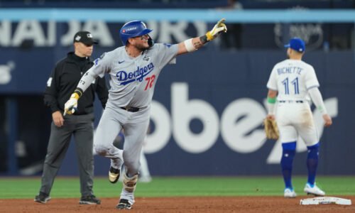 Los Angeles Dodgers second baseman Miguel Rojas (72) reacts after hitting a home run against the Toronto Blue Jays in the ninth inning for game seven of the 2025 MLB World Series at Rogers Centre.