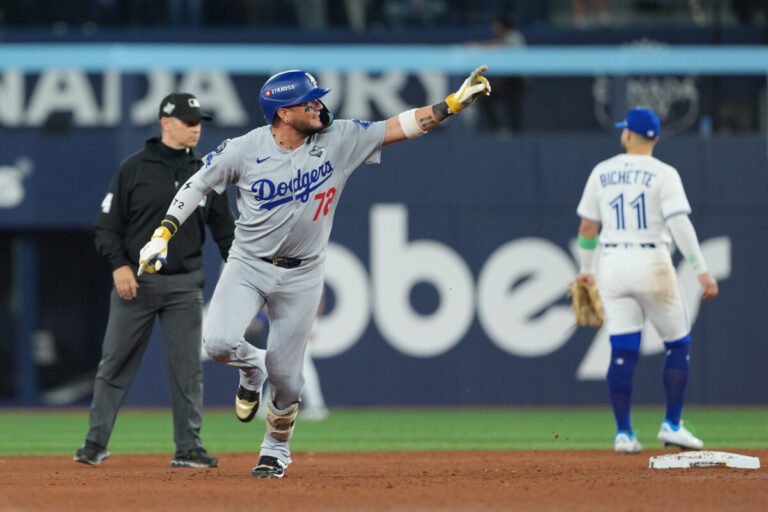 Los Angeles Dodgers second baseman Miguel Rojas (72) reacts after hitting a home run against the Toronto Blue Jays in the ninth inning for game seven of the 2025 MLB World Series at Rogers Centre.