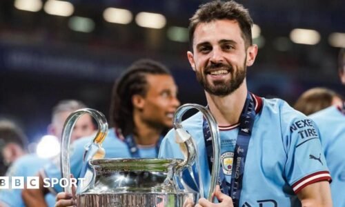 Bernardo Silva holding the Champions League trophy in 2023