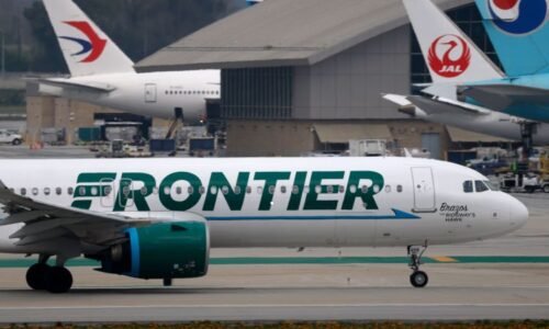 Close call at LAX: Frontier Airlines jet slams on the brakes when two trucks cross its path