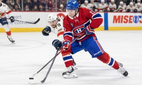 Canadiens sniper Cole Caufield unloads a backhand shot at the Florida net while being pressured by Panthers