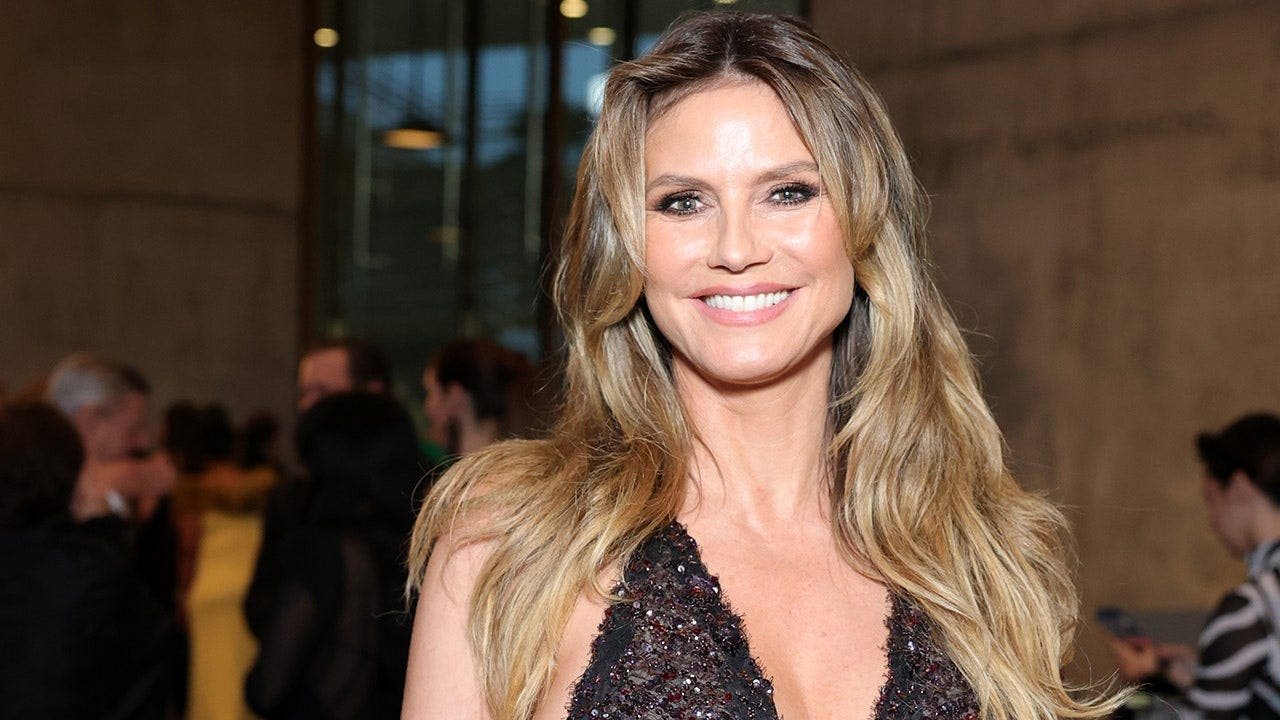 Heidi Klum shares sultry poolside bikini video with her three dogs in tow