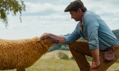 (L to R) Julia-Louis Dreyfus as the voice of Lily, the sheep, and Hugh Jackman as George Hardy in The Sheep Detectives, from Amazon MGM Studios.