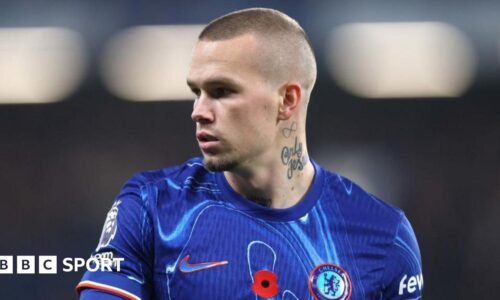 Mykhailo Mudryk looking to his right while playing in a Chelsea kit