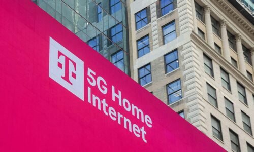 A magenta sign showing T-mobile's logo and 5G home internet in white letters.