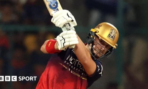 RCB batter Jacob Bethell plays a shot