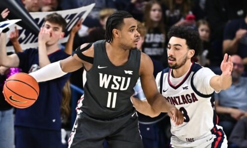 Feb 10, 2026; Spokane, Washington, USA; Washington State Cougars guard Jerone Morton (11) controls the ball against Gonzaga Bulldogs guard Braeden Smith (3) in the first half at McCarthey Athletic Center. Mandatory Credit: James Snook-Imagn Images