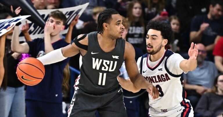 Feb 10, 2026; Spokane, Washington, USA; Washington State Cougars guard Jerone Morton (11) controls the ball against Gonzaga Bulldogs guard Braeden Smith (3) in the first half at McCarthey Athletic Center. Mandatory Credit: James Snook-Imagn Images