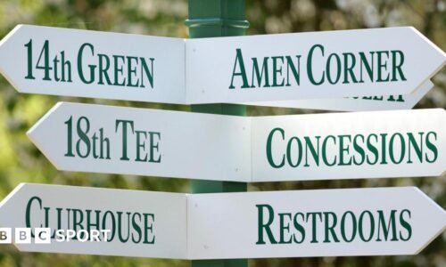 A sign at Augusta National Golf Club showing directions to Amen Corner, the 18th tee, concessions, the clubhouse and restrooms