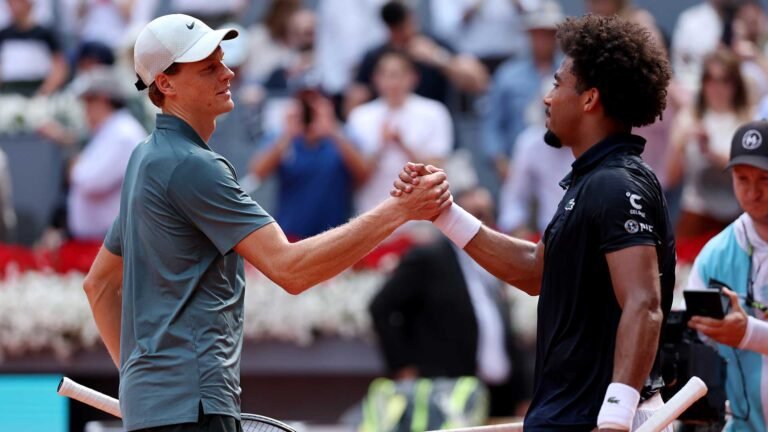 Jannik Sinner and Arthur Fils embrace following their Madrid semi-final on Friday.