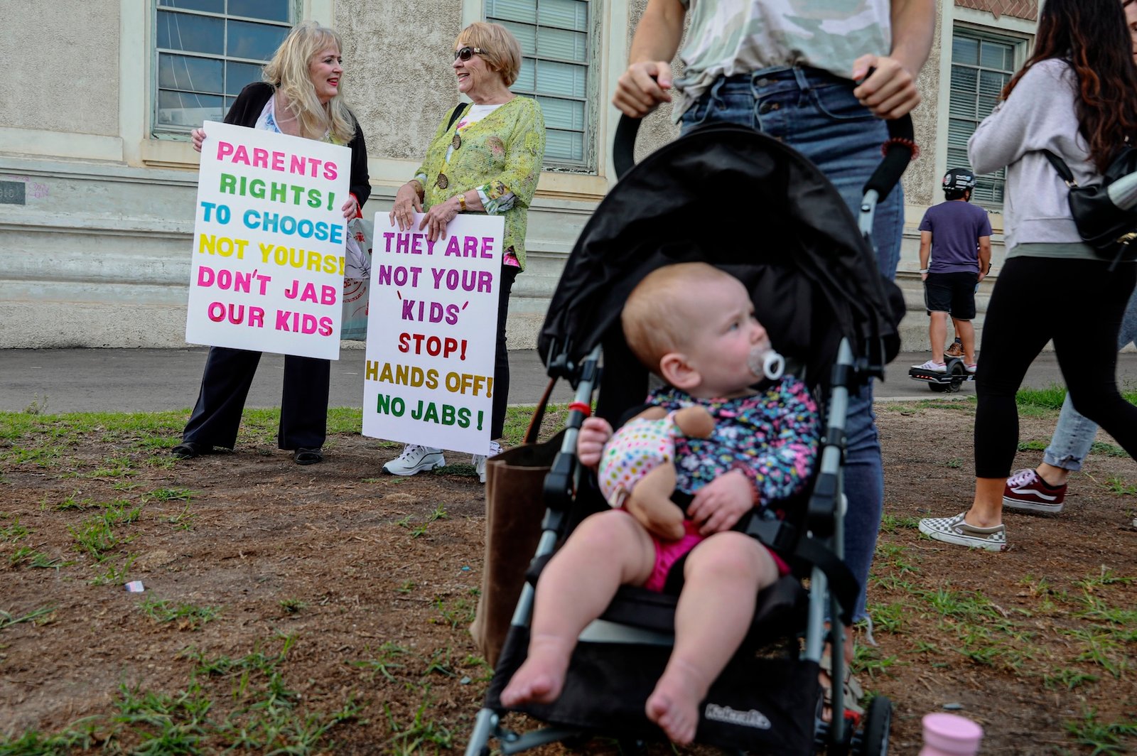 Anti-vaccine protesters stage a protest outside of the San Diego Unified School District office to protest a forced vaccination mandate for students on September 28, 2021 in San Diego, California. The School District was holding a virtual hearing on whether to enact a mandate for students to recieve at least one dose of a COVID vaccine. ((Photo by Sandy Huffaker/Getty Images))