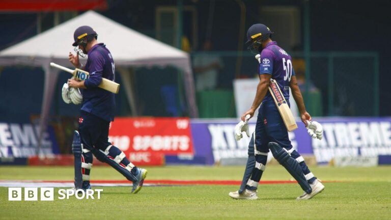 Mark Watt and Safyaan Sharif walk off after Scotland were bowled out