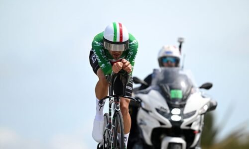 Filippo Ganna rides ahead of a motorbike during the time trial