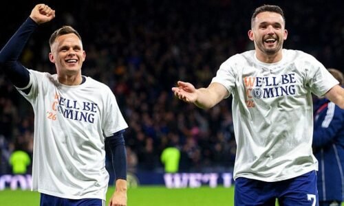 Scotland's Lawrence Shankland (L) and John McGinn celebrate Scotland's qualification to the World Cup after a 4-2 victory over Denmark at Hampden Park.