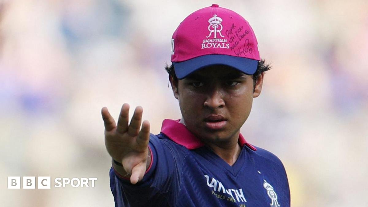 Rajasthan Royals' Vaibhav Sooryavanshi wears a cap with a message and signed by Royal Challengers Bengaluru's Virat Kohli