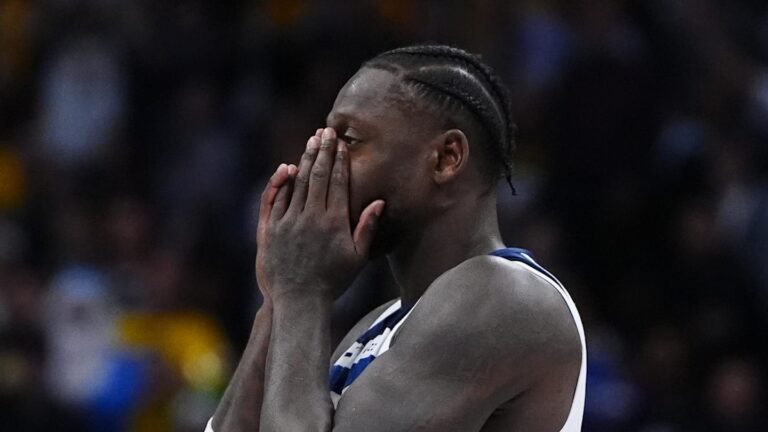 Minnesota Timberwolves forward Julius Randle (30) reacts to a flagrant foul called in overtime against the Denver Nuggets at Ball Arena on December 25, 2025.