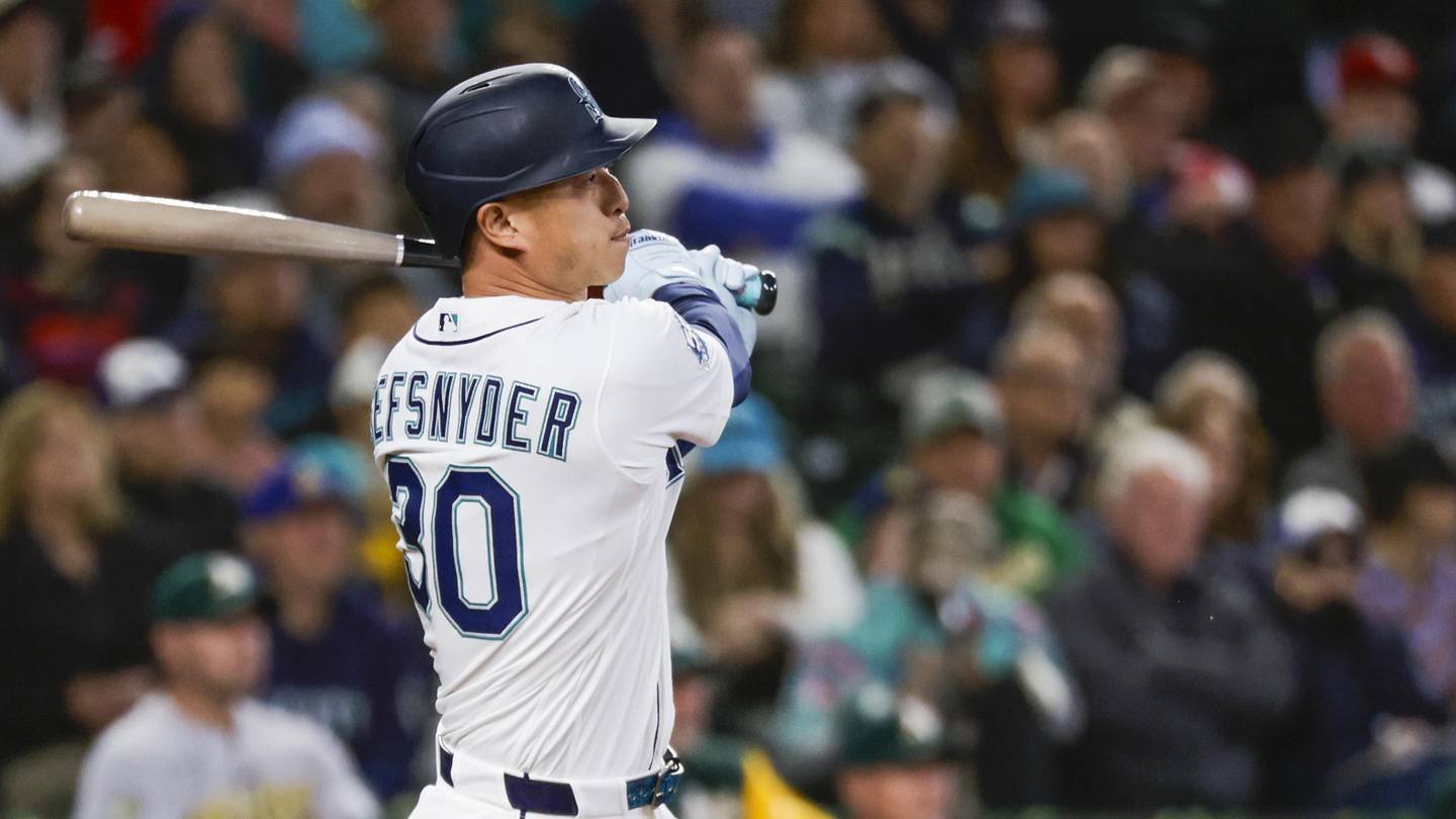 Apr 22, 2026; Seattle, Washington, USA; Seattle Mariners right fielder Rob Refsnyder (30) hits an RBI-sacrifice fly against the Athletics during the sixth inning at T-Mobile Park. Mandatory Credit: Joe Nicholson-Imagn Images