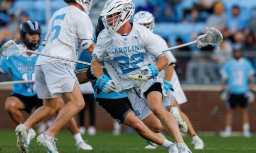 North Carolina's Brady Wambach with the ball after winning a faceoff against Johns Hopkins
