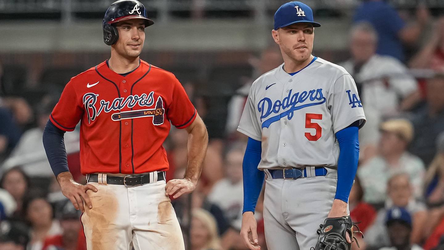 Atlanta Braves first baseman Matt Olson on base next to Los Angeles Dodgers first baseman Freddie Freeman.