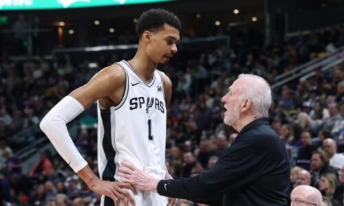 Victor Wembanyama chats with former Spurs coach Gregg Popovich prior to WCF Game 3 vs. Thunder