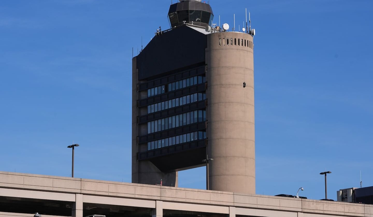 FILE - The control tower at Logan Airport, on Dec. 9, 2025, in Boston.