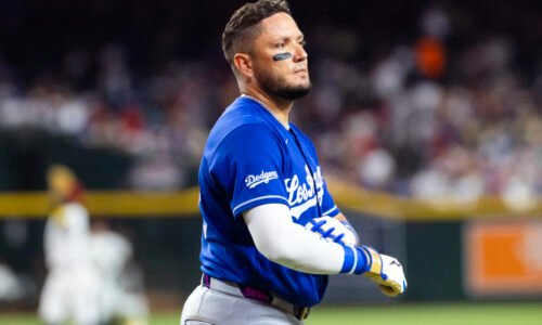 Jun 1, 2026; Phoenix, Arizona, USA; Los Angeles Dodgers batter Miguel Rojas reacts after being called out on strikes via ABS challenge in the fourth inning against the Arizona Diamondbacks at Chase Field. Mandatory Credit: Mark J. Rebilas-Imagn Images