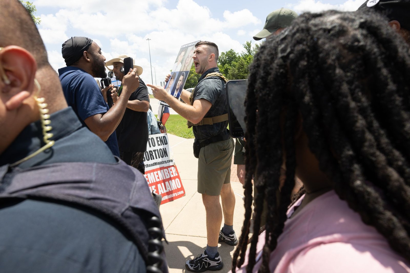Jake Lang is removed by police for violating decorum rules while speaking in opposition to the proposed construction of a mosque and two temples during a city council meeting in Frisco, Tuesday, May 19, 2026.