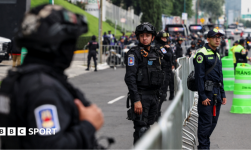Police near the England team's hotel before their arrival for their World Cup last-16 game with Mexico in Mexico City