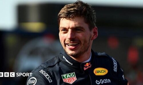 Max Verstappen in a black Red Bull racing outfit