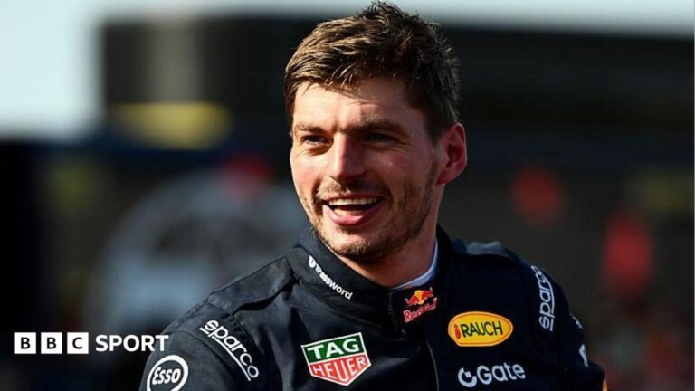 Max Verstappen in a black Red Bull racing outfit