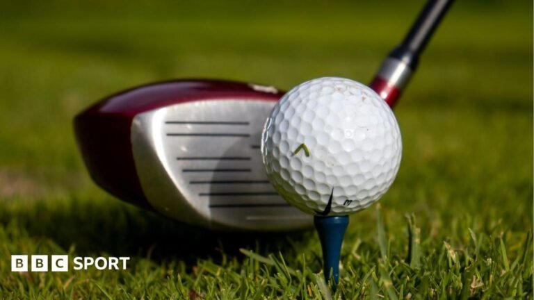 Picture showing golf driver next to a golf ball on a tee